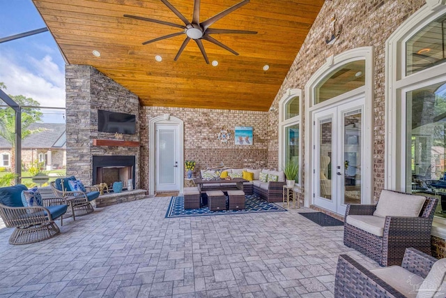 6126 E Fence Rd, Pensacola, FL 32526 - view of patio / terrace with an outdoor living space with a fireplace, french doors, and a ceiling fan