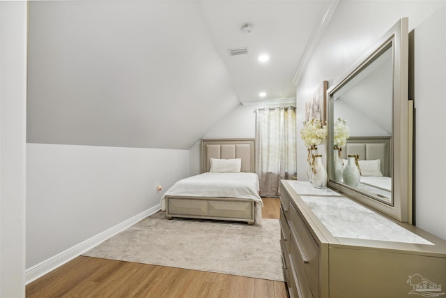 6126 E Fence Rd, Pensacola, FL 32526 - bedroom featuring light wood-type flooring, vaulted ceiling, crown molding, and recessed lighting