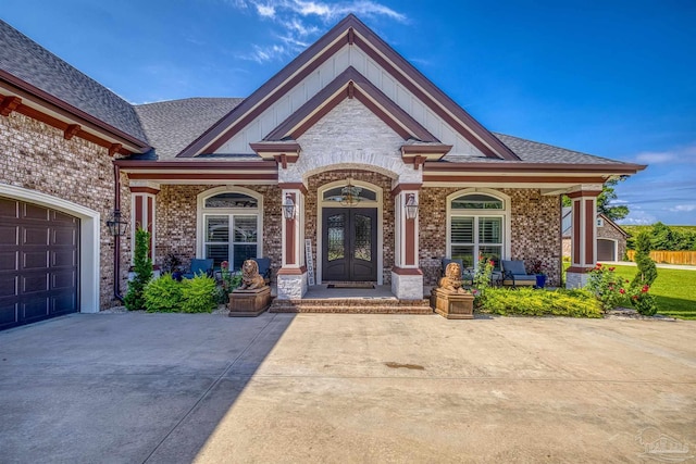 6126 E Fence Rd, Pensacola, FL 32526 - doorway to property featuring covered porch, french doors, brick siding, and driveway