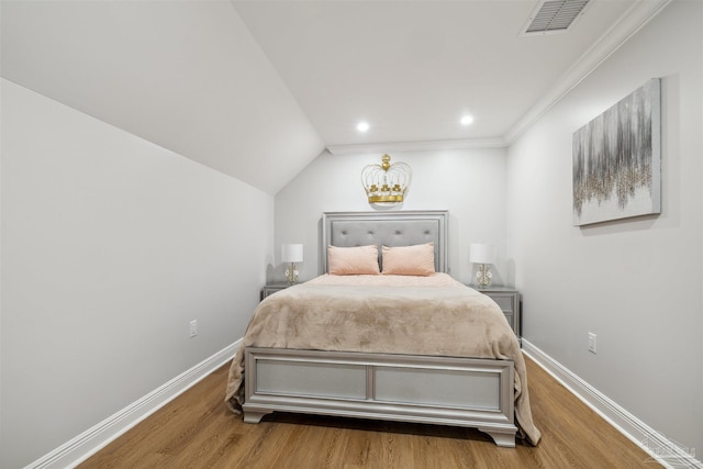6126 E Fence Rd, Pensacola, FL 32526 - bedroom featuring wood finished floors, recessed lighting, and vaulted ceiling