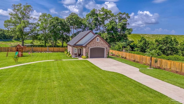 6126 E Fence Rd, Pensacola, FL 32526 - view of front of home featuring concrete driveway, a fenced backyard, a playground, and an attached garage
