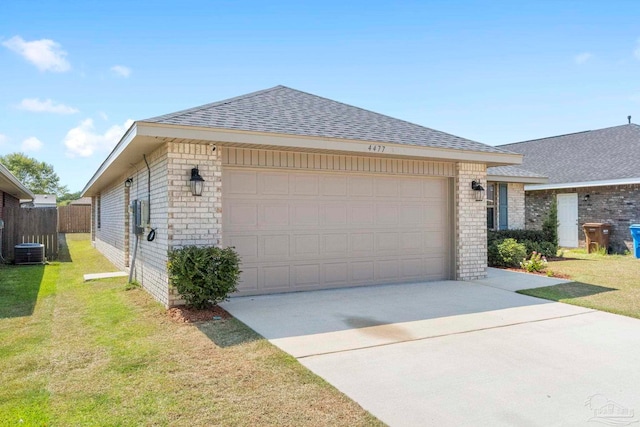 view of side of home featuring a lawn, central air condition unit, and a garage