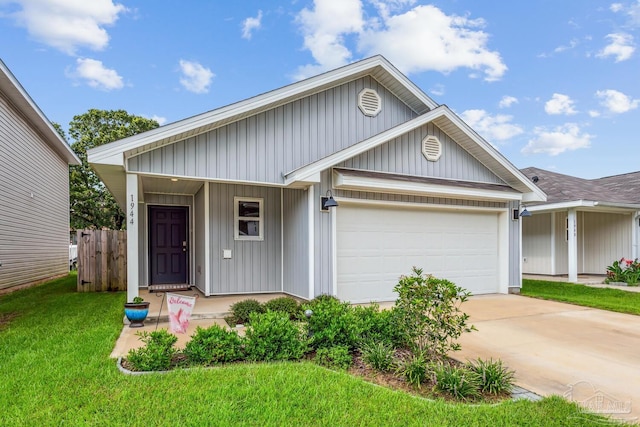 view of front of property featuring a garage and a front lawn