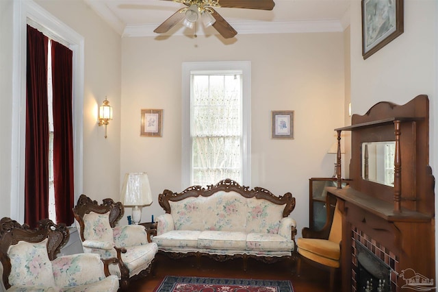 living room featuring crown molding and ceiling fan