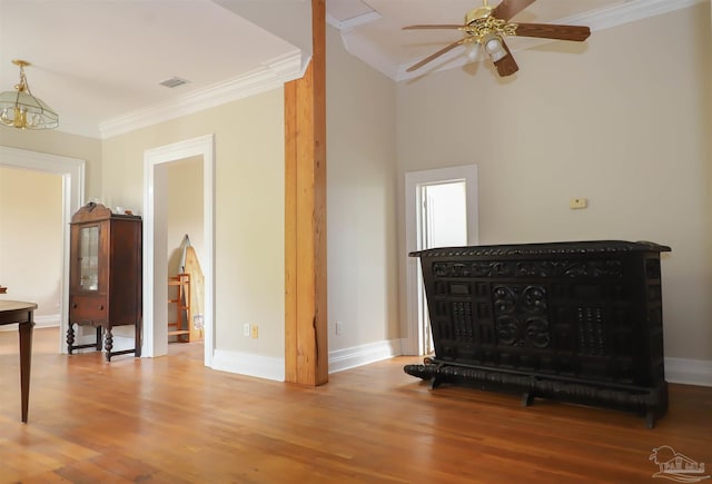 living room featuring hardwood / wood-style flooring and ornamental molding