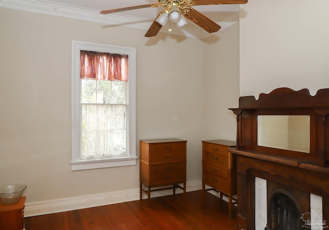 unfurnished room with hardwood / wood-style floors, crown molding, and ceiling fan