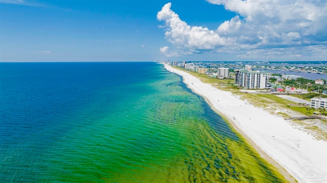 bird's eye view featuring a water view and a view of the beach