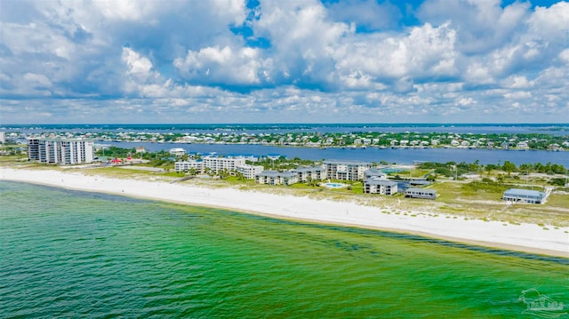 drone / aerial view featuring a water view and a beach view