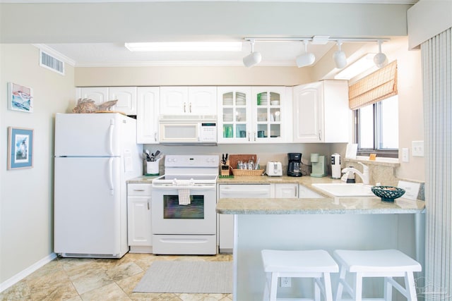 kitchen with white cabinetry, white appliances, ornamental molding, sink, and kitchen peninsula