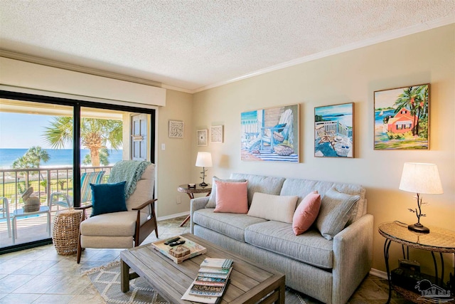 living room featuring a water view, a textured ceiling, ornamental molding, and light tile patterned floors