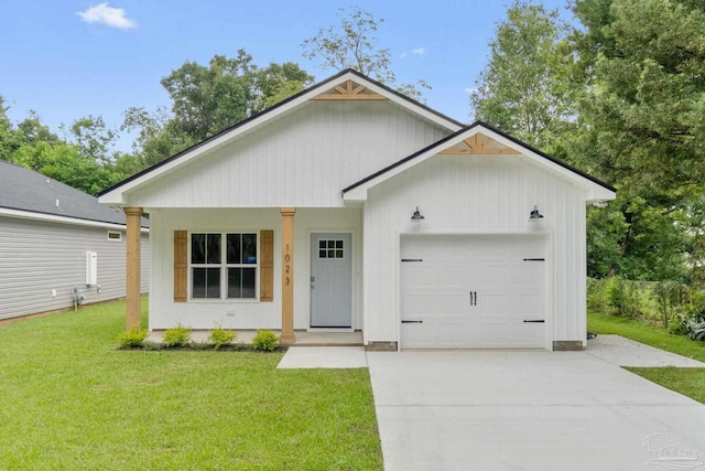 view of front facade featuring a porch, an attached garage, concrete driveway, and a front lawn