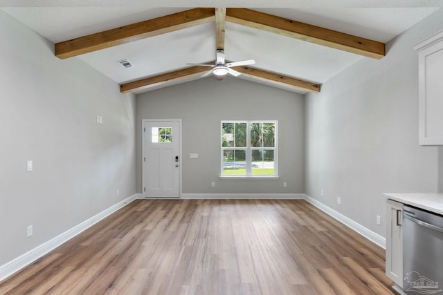 unfurnished living room with visible vents, vaulted ceiling with beams, baseboards, and wood finished floors