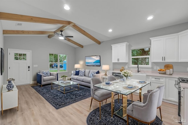 interior space featuring light wood finished floors, visible vents, recessed lighting, and lofted ceiling with beams