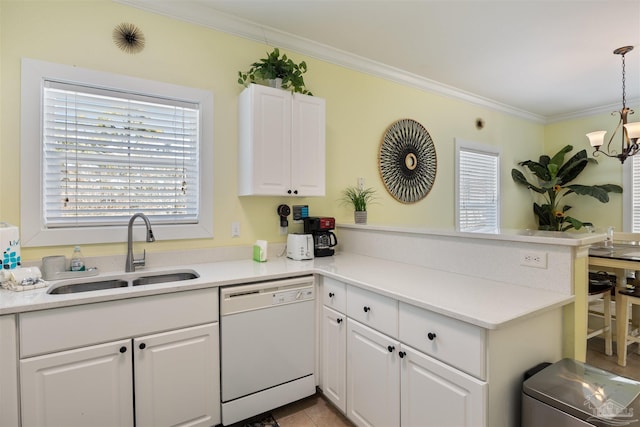 kitchen featuring decorative light fixtures, dishwasher, sink, white cabinets, and kitchen peninsula