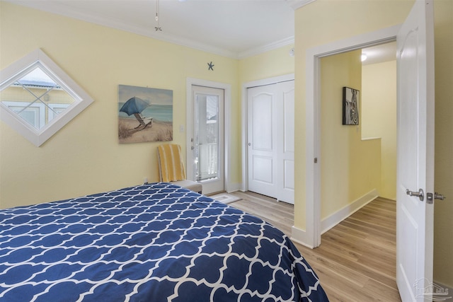 bedroom with ornamental molding and wood-type flooring