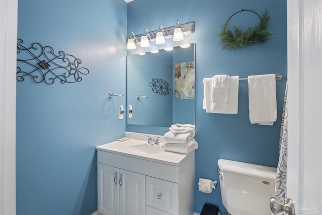 bathroom with vanity and toilet