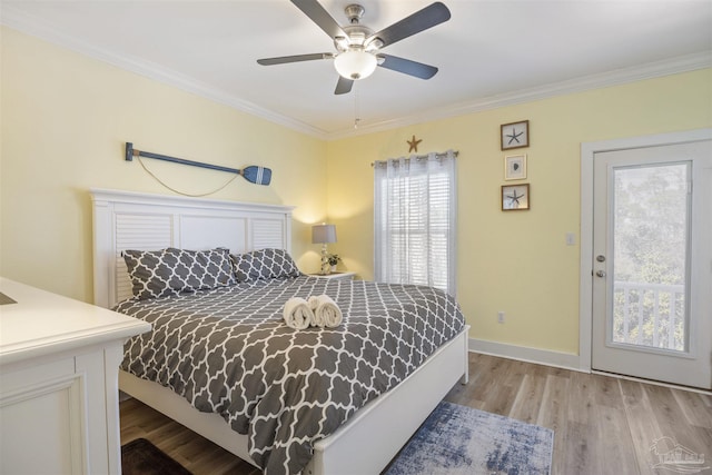 bedroom featuring ceiling fan, ornamental molding, and light hardwood / wood-style floors