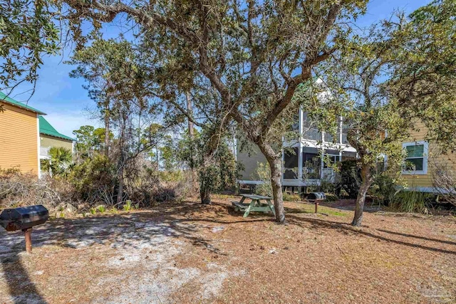 view of yard featuring a sunroom