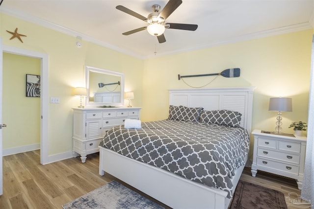 bedroom with crown molding, ceiling fan, and light wood-type flooring