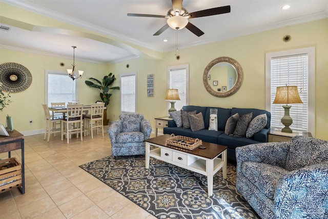 tiled living room featuring ornamental molding and ceiling fan with notable chandelier