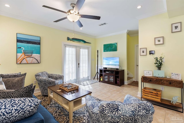 living room with french doors, ceiling fan, ornamental molding, and light tile patterned floors