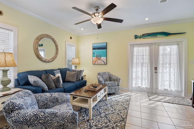 living room featuring french doors, ceiling fan, ornamental molding, and light tile patterned floors