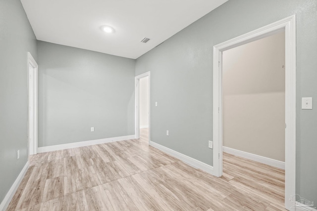 empty room with light wood-type flooring