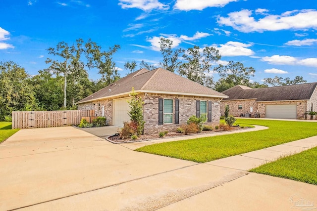 ranch-style house featuring brick siding, fence, a front lawn, driveway, and a garage