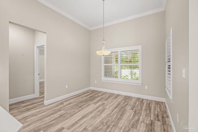 unfurnished room featuring light hardwood / wood-style flooring and crown molding