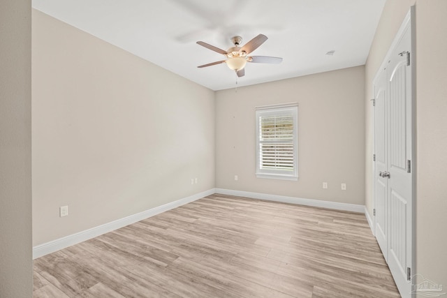 unfurnished bedroom with baseboards, ceiling fan, and light wood finished floors