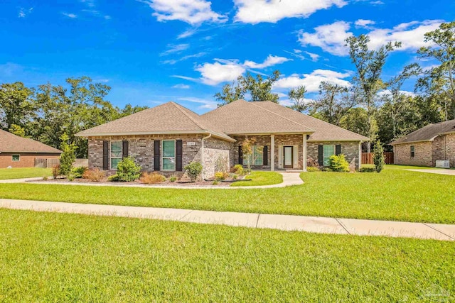 ranch-style house with a front lawn