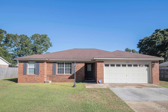 ranch-style home with a front yard and a garage