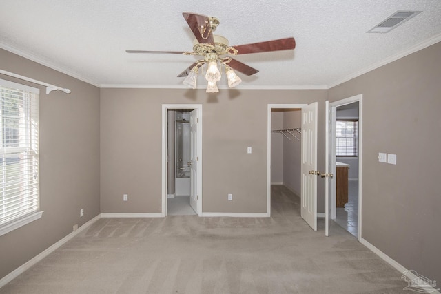 4416 Bellwood Cir, Pace, FL 32571 - unfurnished bedroom featuring a spacious closet, visible vents, crown molding, and light carpet