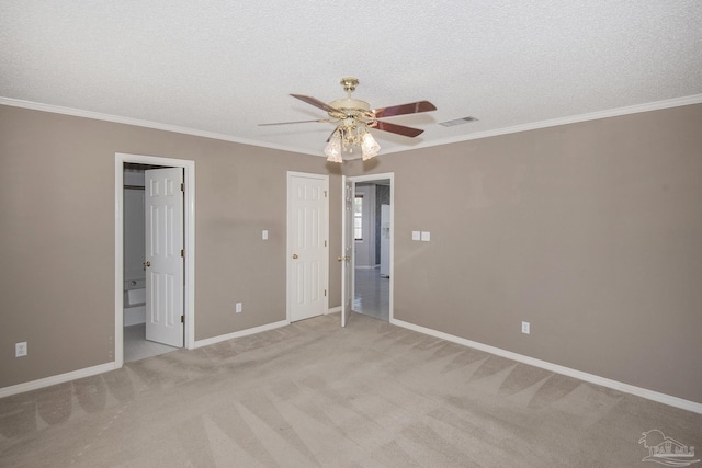 4416 Bellwood Cir, Pace, FL 32571 - unfurnished bedroom featuring a textured ceiling, light colored carpet, baseboards, ornamental molding, and visible vents