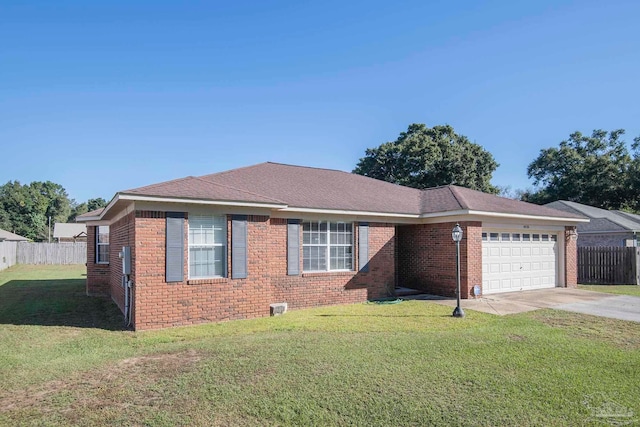 view of front of property featuring a front yard and a garage