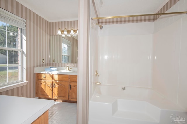 bathroom with vanity, tile patterned floors, bathing tub / shower combination, and ornamental molding