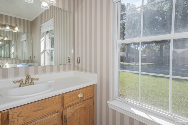 4416 Bellwood Cir, Pace, FL 32571 - bathroom with ornamental molding, vanity, and wallpapered walls