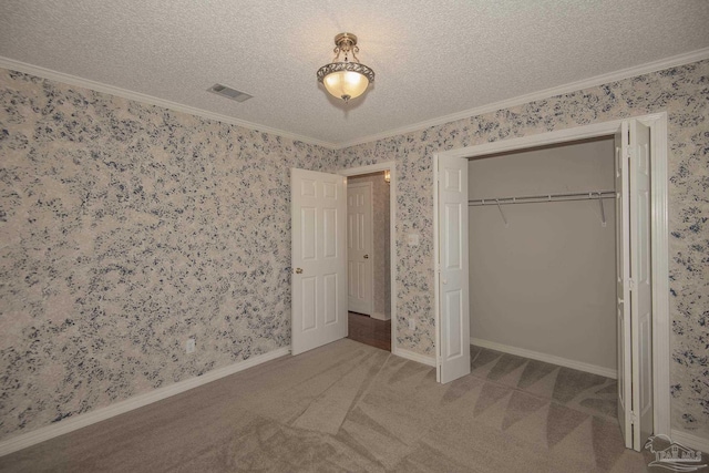 4416 Bellwood Cir, Pace, FL 32571 - unfurnished bedroom with wallpapered walls, visible vents, a textured ceiling, and crown molding