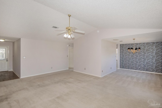 4416 Bellwood Cir, Pace, FL 32571 - unfurnished living room with ceiling fan with notable chandelier, light carpet, vaulted ceiling, and baseboards