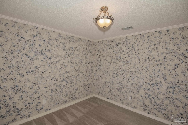 4416 Bellwood Cir, Pace, FL 32571 - carpeted spare room featuring wallpapered walls, a textured ceiling, and visible vents