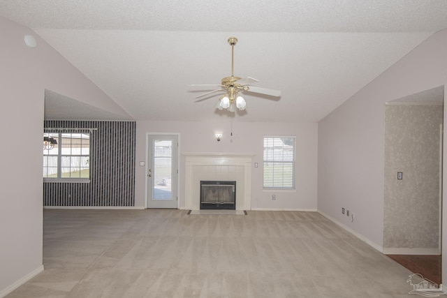 4416 Bellwood Cir, Pace, FL 32571 - unfurnished living room with a wealth of natural light, lofted ceiling, a ceiling fan, and light carpet