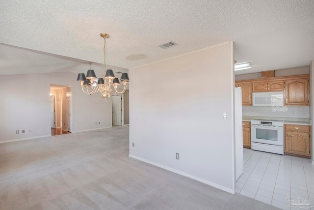 kitchen featuring light carpet, backsplash, a chandelier, decorative light fixtures, and white appliances