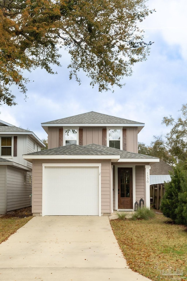 view of front of property with concrete driveway