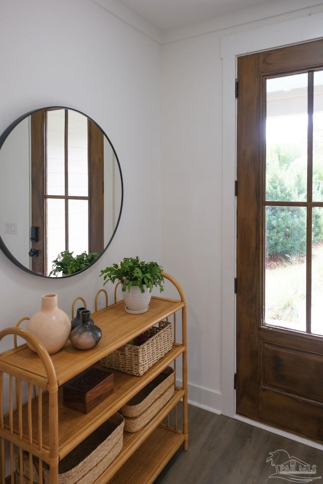 interior space featuring ornamental molding and wood finished floors