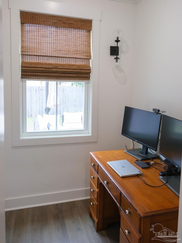 office space with baseboards and dark wood-style flooring