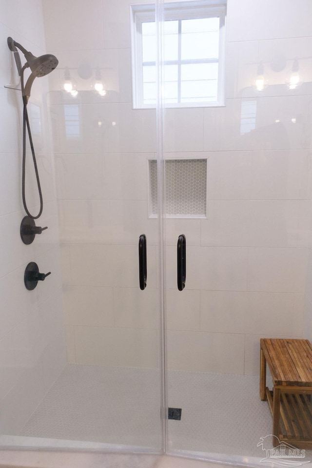 full bathroom featuring a shower stall