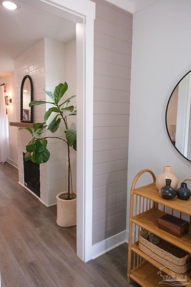 interior space with baseboards and wood finished floors