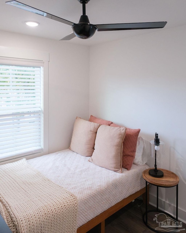 bedroom with wood finished floors and ceiling fan