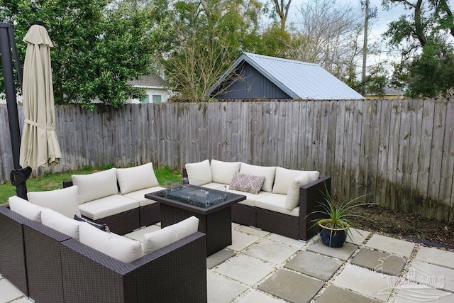 view of patio / terrace featuring an outdoor hangout area and a fenced backyard