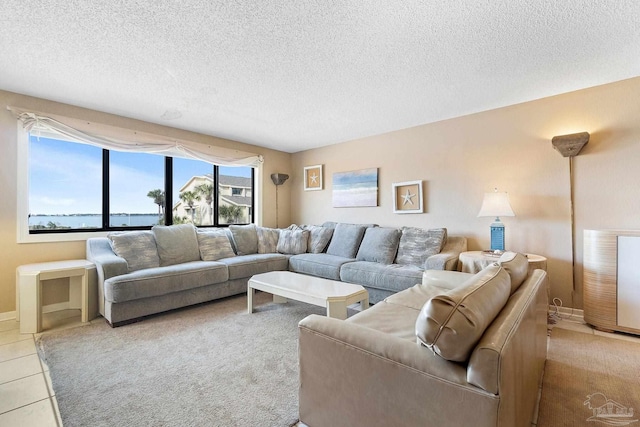 tiled living room featuring a textured ceiling